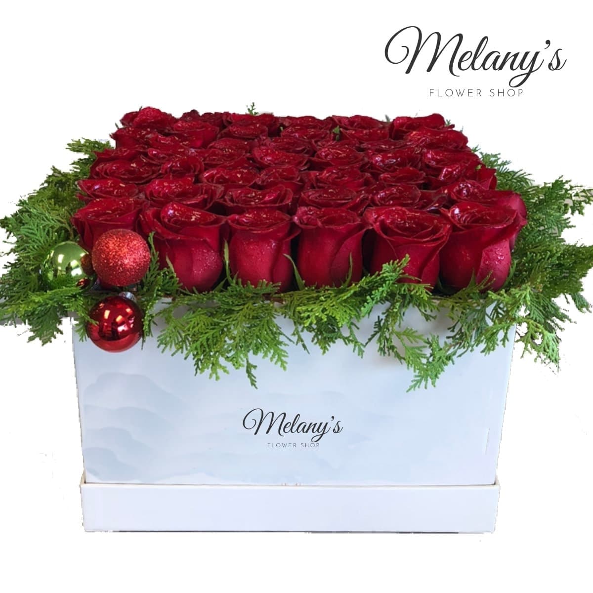caja de rosas con detalles navideños